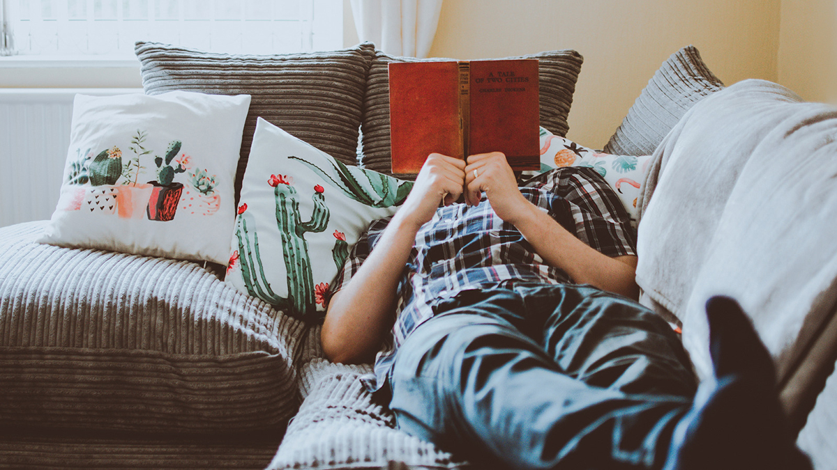 Man reading on couch