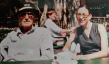 An old photo of a man and woman having lunch