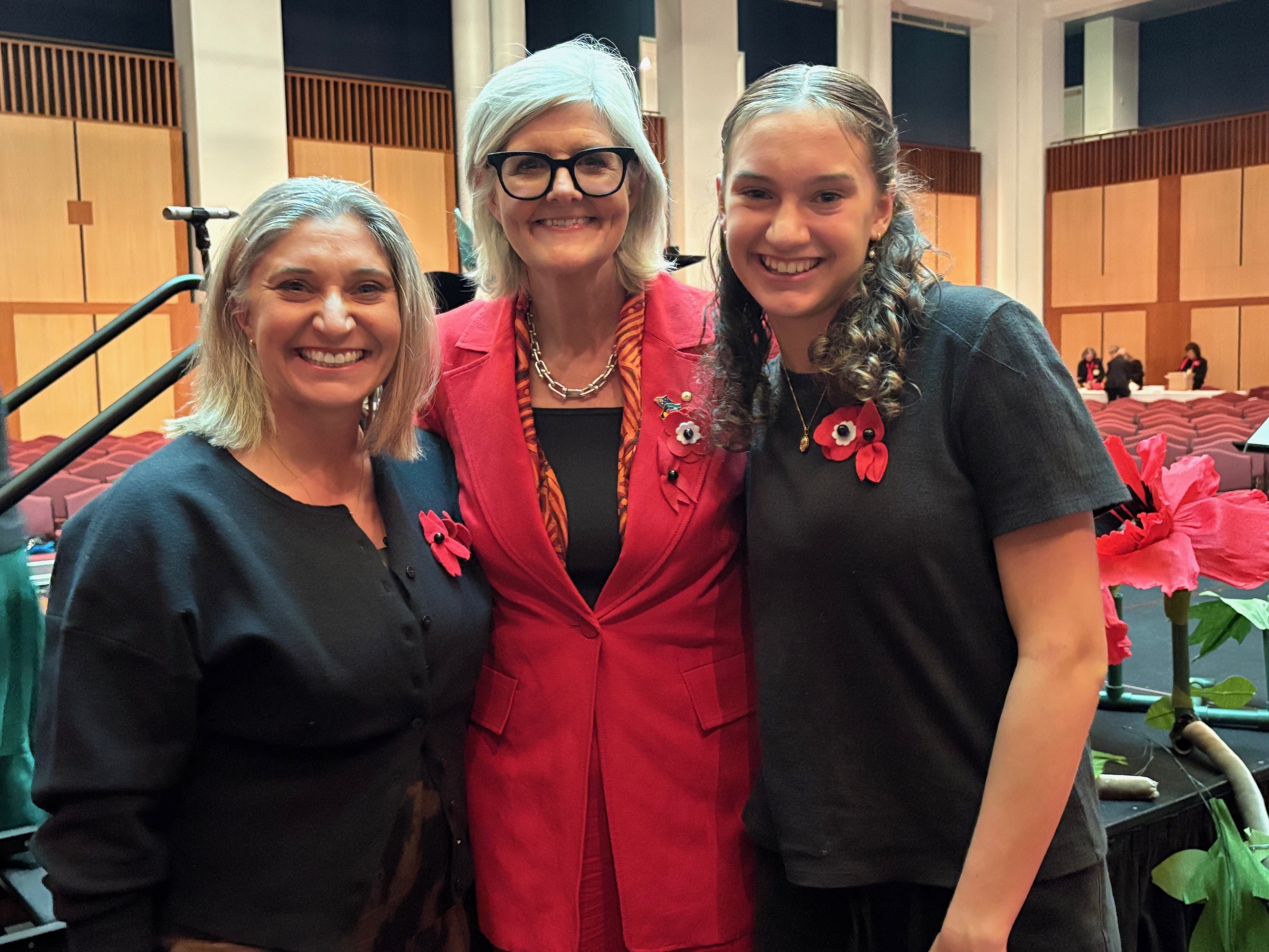 Gwen (left) is pictured with her daughter Emily and the Governor-General, Her Excellency the Honourable Sam Mostyn AC, at the 1000 Voice for Recognition and Remembrance. Emil performed in the OZY Youth Choir