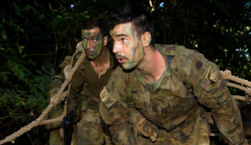Two soldiers conduct an exercise