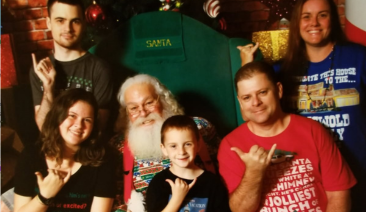 A family poses for a Christmas photo