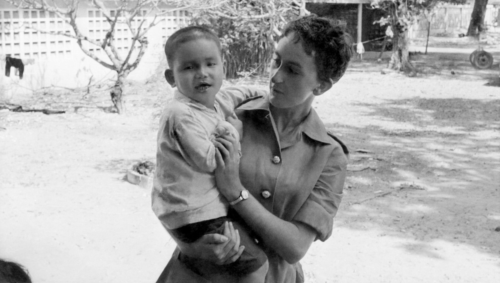 Jan McCarthy whilst serving with a young boy