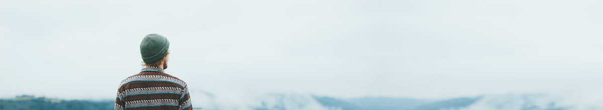 Man looking out towards mountains