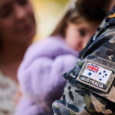 A man in ADF uniform with a family