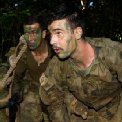 Two soldiers conduct an exercise